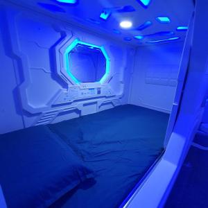 a small room with a bed in an airplane at ZZZ Sleep Mode Capsules- Larkin in Johor Bahru