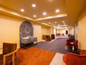 a lobby of a hotel with chairs and a waiting room at Mercure Istanbul Bakirkoy in Istanbul