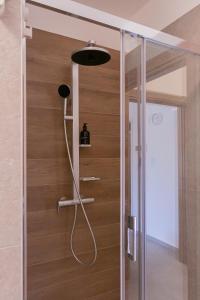 a shower in a bathroom with a glass door at Residence Black Line - Affitti Brevi Italia in Foggia +42 photos