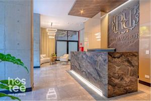 a lobby with a reception desk in a building at R211 Loft with large balcony, infinity pool and spa in Estación El Salto +25 photos