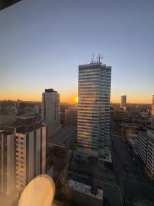 a view of a city skyline with a tall building at Studio Downtown , Rodgers Views, AC, Heated Free Underground Parking in Edmonton +39 photos