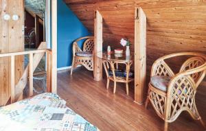 a dining room with a table and two chairs at 2 Bedroom Awesome Home In Abbekås in Abbekås