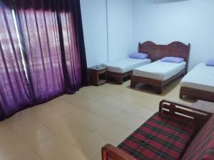 a room with two beds and a couch in it at MARIA HOSTEL FOREIGNERS ONLY-CRISS RESORT-NAAMA BAY-CITY CeNTER in Sharm El Sheikh +12 photos
