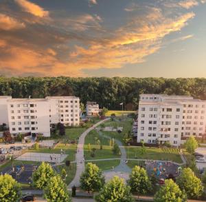 a park in the middle of a city with buildings at Aze - Green Business in Bucharest