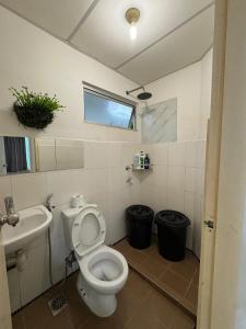 a bathroom with a toilet and a sink at Roswad Homestay University Condo Apartment Phase 2 in Kota Kinabalu