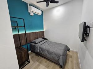 Ένα ή περισσότερα κρεβάτια σε δωμάτιο στο Roomstay KOBANAS