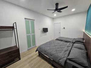 Ένα ή περισσότερα κρεβάτια σε δωμάτιο στο Roomstay KOBANAS