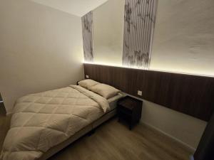 Ένα ή περισσότερα κρεβάτια σε δωμάτιο στο Roomstay KOBANAS