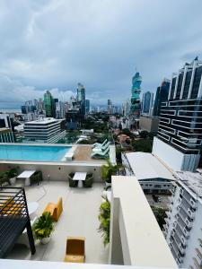 a view of a city from the balcony of a building at Moderno apartamento en el centro de Obarrio in Panama City +19 photos