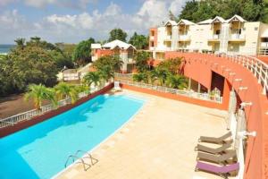 an image of a swimming pool on a building at La baie du Pitaya in La Trinité