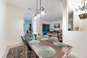a dining room and living room with a table and chairs at Large 5BR Home – Pool Table Yard Beaches in Delta