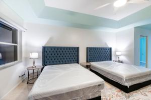 a bedroom with two beds and a window at Large 5BR Home – Pool Table Yard Beaches in Delta