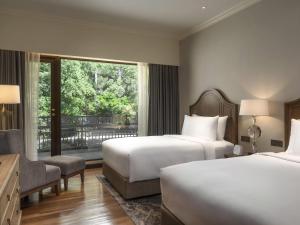 Ένα ή περισσότερα κρεβάτια σε δωμάτιο στο Mövenpick BDMS Wellness Resort Bangkok