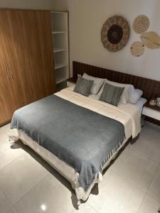 a bedroom with a large bed in a room at Vista al Rio by renty in Encarnación