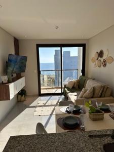 a living room with a couch and a table at Vista al Rio by renty in Encarnación