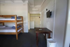 Ένα ή περισσότερα κρεβάτια σε δωμάτιο στο Phillip Island Park Lane Holiday Park