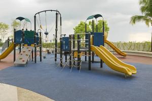 a playground with a slide in a park at Alma's Suites Luna Studio 2Pax Puteri Harbour by Our Stay in Iskandar Puteri