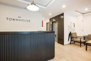 a view of a showroom with a table and chairs at Townhouse Lords Regency in Indore