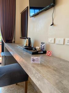 a reception desk in a hotel room at YES Apartments in Ban Saiyuan (1) +11 photos