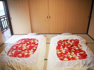 Katil atau katil-katil dalam bilik di 江田島宿りNORA Private Vacation Home