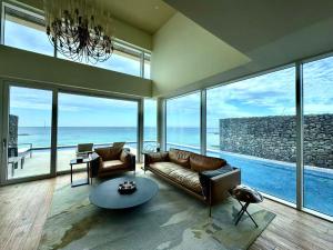 a living room with a couch and a table at Xinsu Woljeongli in Jeju