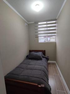 Postel nebo postele na pokoji v ubytování Departamento valle volcanes, Puerto Montt + 4 fotografie