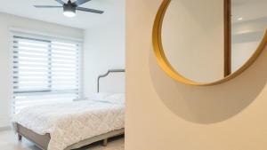 Ένα ή περισσότερα κρεβάτια σε δωμάτιο στο Cómodo condominio a pasos de Vidanta World +14 φωτογραφίες