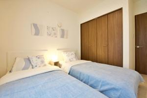 due letti uno accanto all'altro in una camera da letto di Riola 4 a Onna