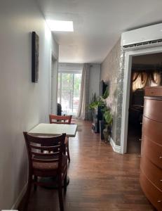 a kitchen and dining room with a table and chairs at 2 Beds availabe and self service small breakfast in Montréal