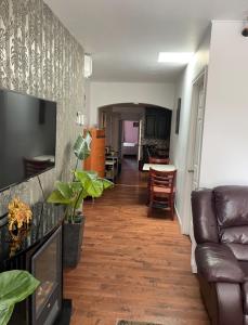 a living room with a couch and a table at 2 Beds availabe and self service small breakfast in Montréal