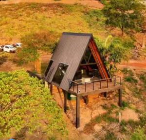 an overhead view of a small house on a hill at Chalé Mirante Morro dos Ventos in Chapada dos Guimarães +21 photos