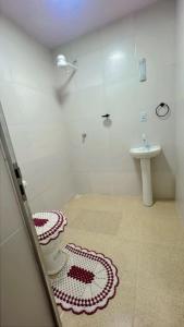 a bathroom with a toilet and a sink at Hall dos parques in Belém