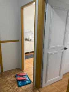 an open door to a room with a kitchen at fully appartement in Quitangil +1 photo