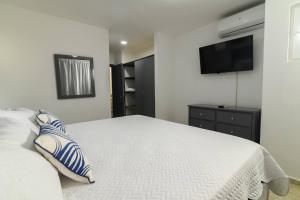 Ένα ή περισσότερα κρεβάτια σε δωμάτιο στο Casa Mango- Relax - Pool Stunning Views +27 φωτογραφίες