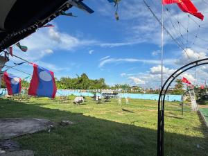 a view of a park with flags on the grass at 8ເຮືອນພັກ 8Hotel 8号旅馆 in Vientiane