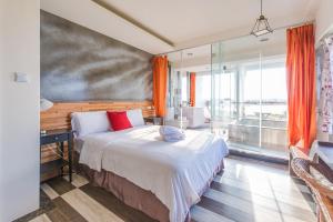 Postel nebo postele na pokoji v ubytování Malibu OceanView Homestay