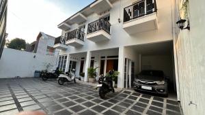 two motorcycles parked in front of a building at Hause of Bejo Yogyakarta in Demangan