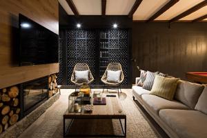 a living room with a couch and a fireplace at Quinta de S.Bernardo - Winery & Farmhouse in Mesão Frio