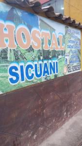 SicuaniにあるHostal SICUANIの壁に貼られた地元の昭和南の看板