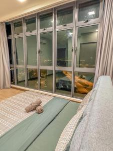 a bed in a room with a large window at Starry x B12 Sea View I Netflix I 3 Bedrooms in Masai