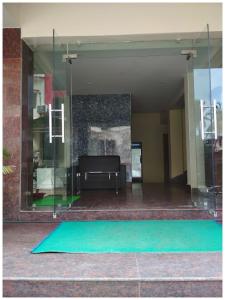 a green mat in the middle of a building at HOTEL TRIPLE -TREE Near Railway Station - Fully Air Conditioning- Best In Bhubneshwar Hotel in Cuttack