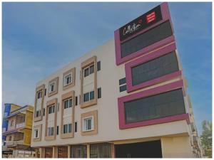a building with a sign on the side of it at HOTEL TRIPLE -TREE Near Railway Station - Fully Air Conditioning- Best In Bhubneshwar Hotel in Cuttack