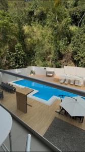 a swimming pool on top of a boat at Los Bosques INN in San Ramón