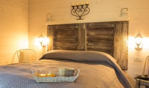 A bed or beds in a room at Ledro Mountain Chalet