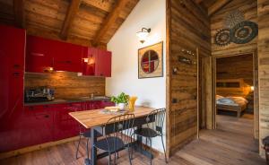 A bed or beds in a room at Ledro Mountain Chalet