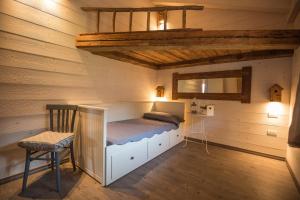A bed or beds in a room at Ledro Mountain Chalet