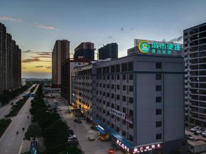 a building with a sign on top of it in a city at City Comfort Inn Nanning Huanan City in Nanning