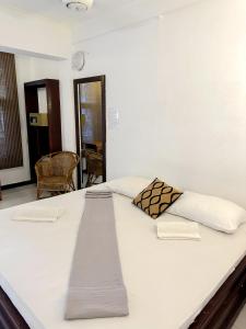 Ένα ή περισσότερα κρεβάτια σε δωμάτιο στο Hotel Surf Resort