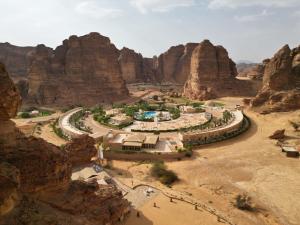an aerial view of a resort in a canyon at Shaden Resort in AlUla
