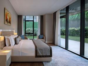Ένα ή περισσότερα κρεβάτια σε δωμάτιο στο Movenpick Living Istanbul West +195 φωτογραφίες
